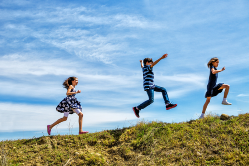 Children playing at a campsite