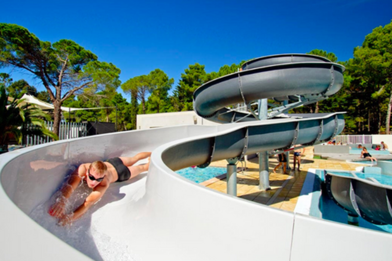 Boy on waterslide at Taxo Les Pins campsite