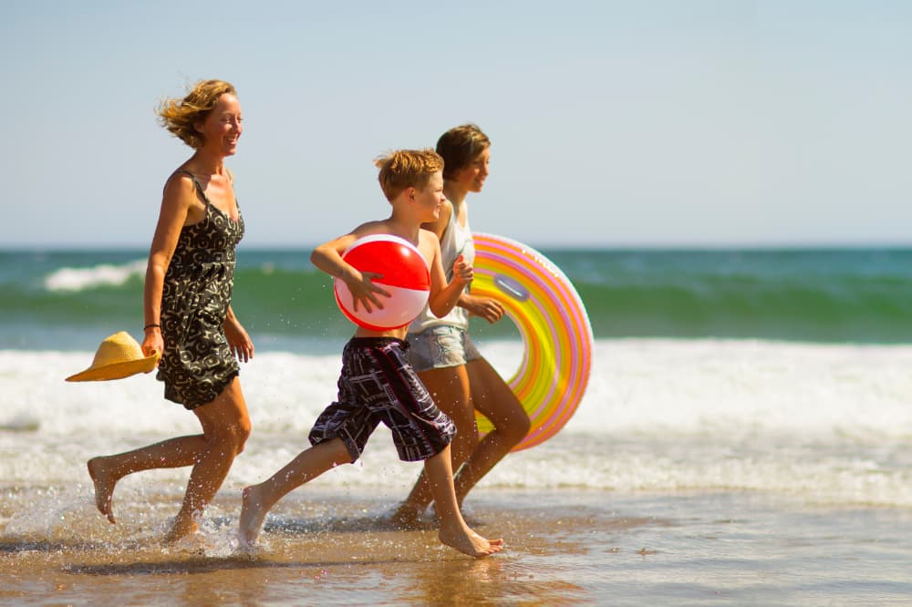 Family_at_the_beach_on_a_campsite_holiday_on_Spain